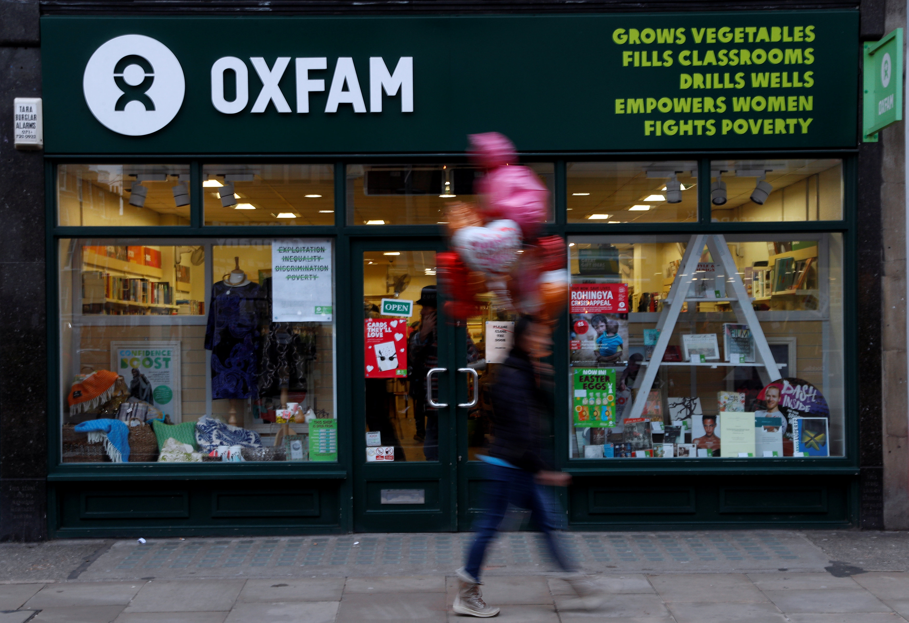 A pedestrian walks past a branch of Oxfam, in London, Britain February 12, 2018.