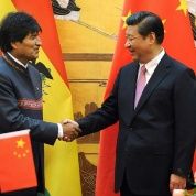 Bolivian President Evo Morales shakes hands with Chinese President Xi Jinping.