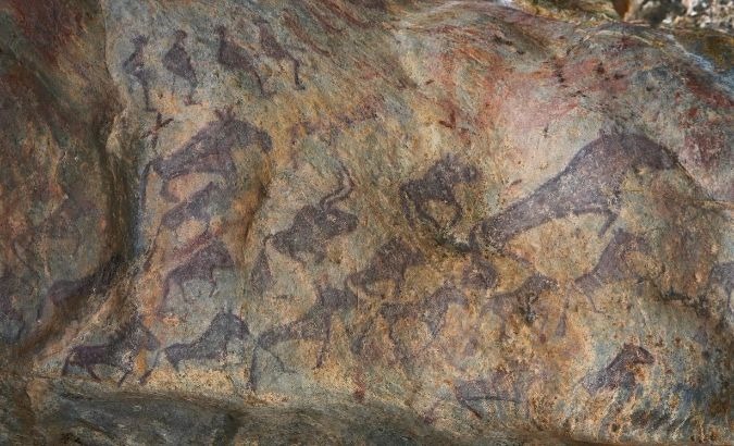 According to Chinese ski historian Shan Zhaojian, archaeologists have dated these paintings as 10,000 to 30,000 years old, They depict people wearing what appears to be skiis and herds of animals walking below them.
