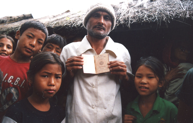 Bhutanese refugees in Beldangi I presenting a Bhutanese passport. It is a legal passport of Bhutan that many Bhutanese Refugees surreptitiously took with themselves when they were forcefully deported from Bhutan.