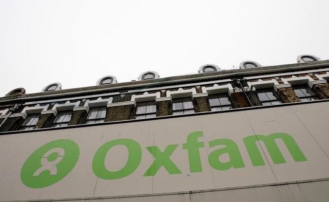The Oxfam logo is seen on a signage outside a store in Dalston in east London, Britain November 28, 2008.