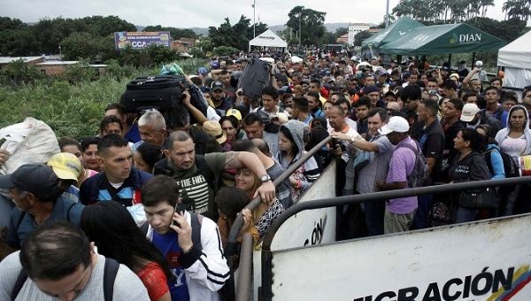 People queue to try to cross into Venezuela from Colombia through the Simon Bolivar international bridge in Cucuta, Colombia February 13, 2018