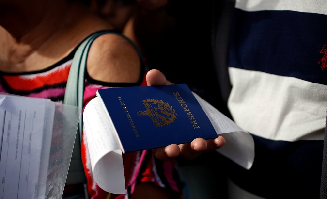 Pedro Rabelo holds his passport in Habana, Cuba. Feb. 9, 2018.