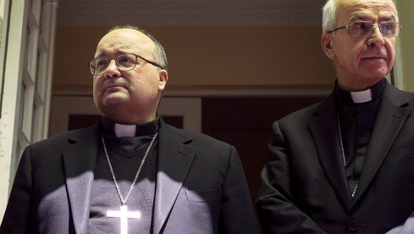 Vatican special envoy Archbishop Charles Scicluna (L) and Apostolic Nuncio to Chile Ivo Scapolo attend a news conference in Santiago, Chile. 