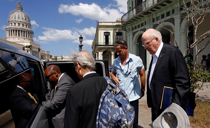 U.S. Senator Leahy, who leads a congressional delegation to meet with Cuban government officials, small business entrepreneurs and others, boards a car in Havana.