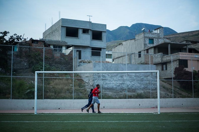 Young soccer players run around the field to warm up for practice in the valley. The region now home to some 20,000 Ecuadoreans was once controlled by seven plantations that together owned over 2,000 slaves.