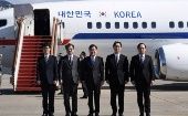 Members of South Korean delegation pose before boarding an aircraft as they leave for Pyongyang at a military airport in Seongnam, South Korea March 5, 2018.