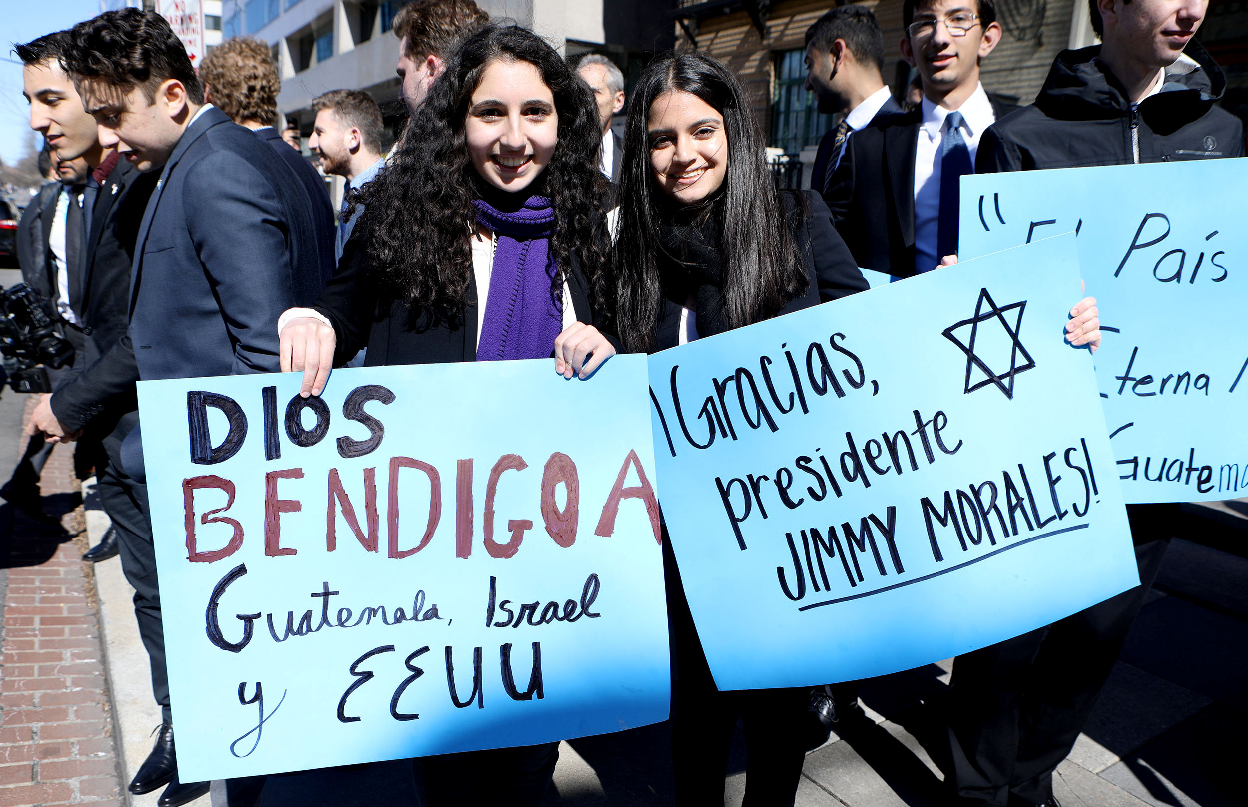 Members of the Israel community support Guatemalan President Morales in Washington. Placard reads 