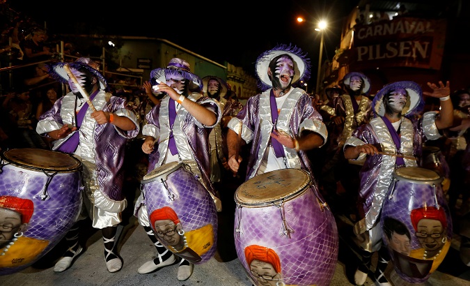 Members of a comparsa, an Uruguayan carnival group, participate in the Llamadas parade, a street fiesta with a traditional Afro-Uruguayan roots, in Montevideo, Uruguay February 10, 2018.