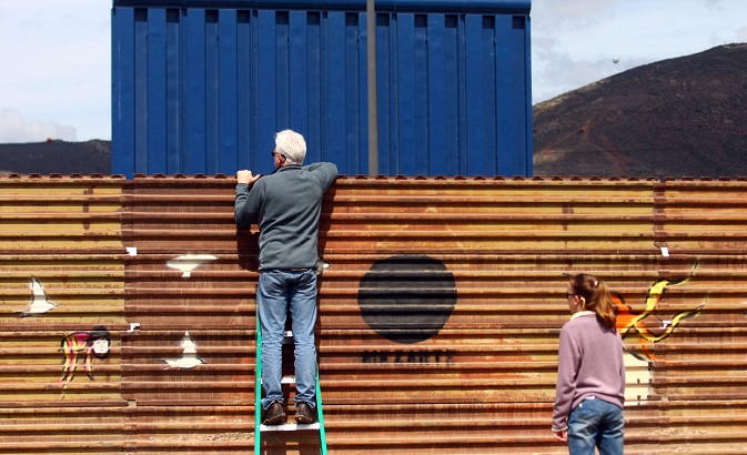 A prototype for U.S. President Donald Trump's border wall with Mexico behind the current border fence in Tijuana, Mexico, March 11, 2018.