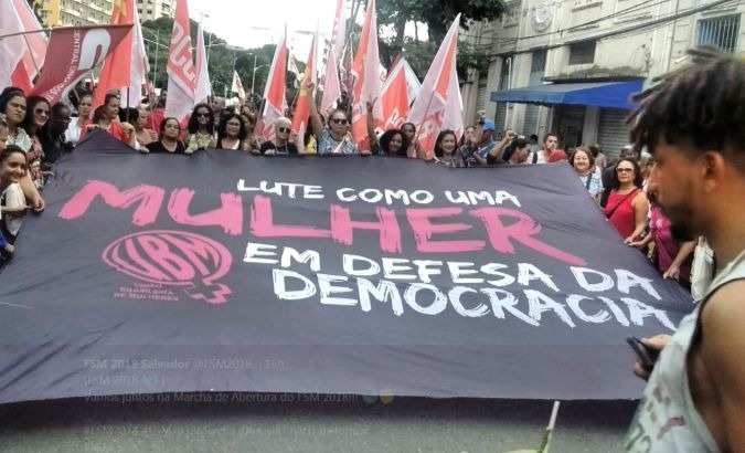 Women march at the beginning of the 13th World Social Forum in Salvador, Brazil.