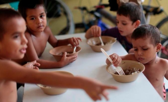 Children have a meal in Mexico.