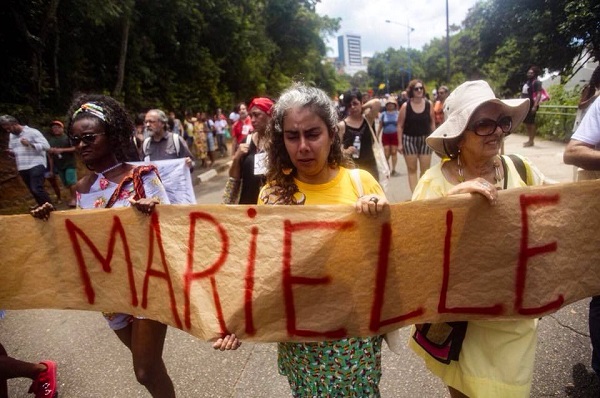 Participants of the World Social Forum protesting Marielle's execution. #MariellePRESENTE