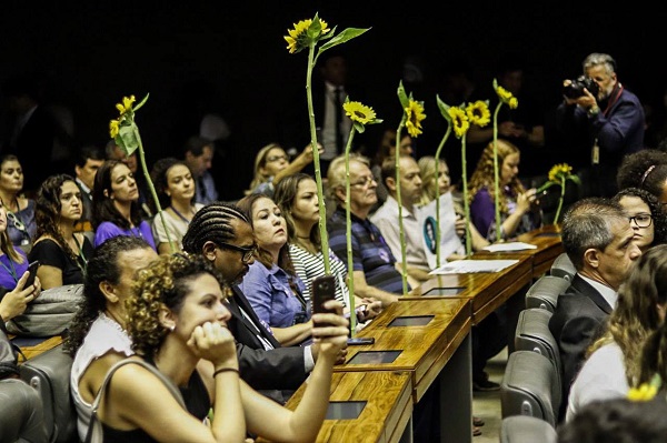 Parliamentarians carried flowers as they sat on the congress.