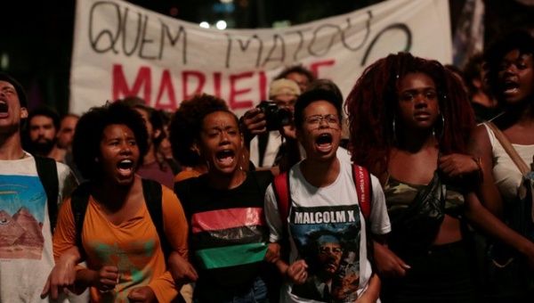 People take part in a rally against the murder of Brazilian councilwoman Marielle Franco, in Sao Paulo, Brazil March 15, 2018.