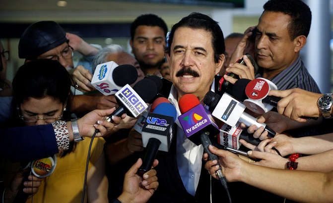 Former Honduran President Manuel Zelaya speaks to journalists upon arriving at Toncontin International Airport in Tegucigalpa, Honduras March 13, 2018.