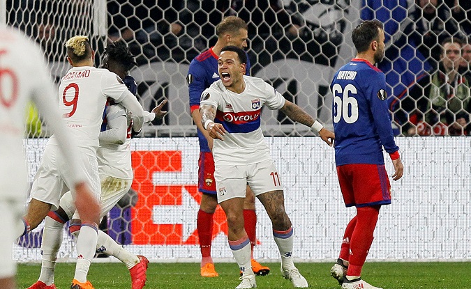 Lyon's Maxwel Cornet celebrates with Mariano and Memphis Depay after scoring their first goal during the game Olympique Lyonnais vs CSKA Moscow on March 15, 2018