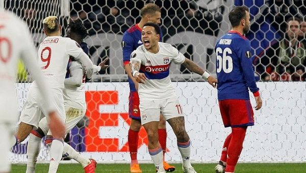 Lyon's Maxwel Cornet celebrates with Mariano and Memphis Depay after scoring their first goal during the game Olympique Lyonnais vs CSKA Moscow on March 15, 2018