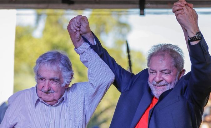 Former Uruguyan President Jose Mujica (L) and former Brazilian President Luiz Inacio Lula da Silva (R).