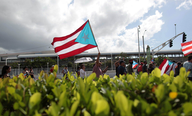 People march in support of becoming an independent nation as the U.S. island territory of Puerto Rico voted in favor of becoming the 51st state in 2017.