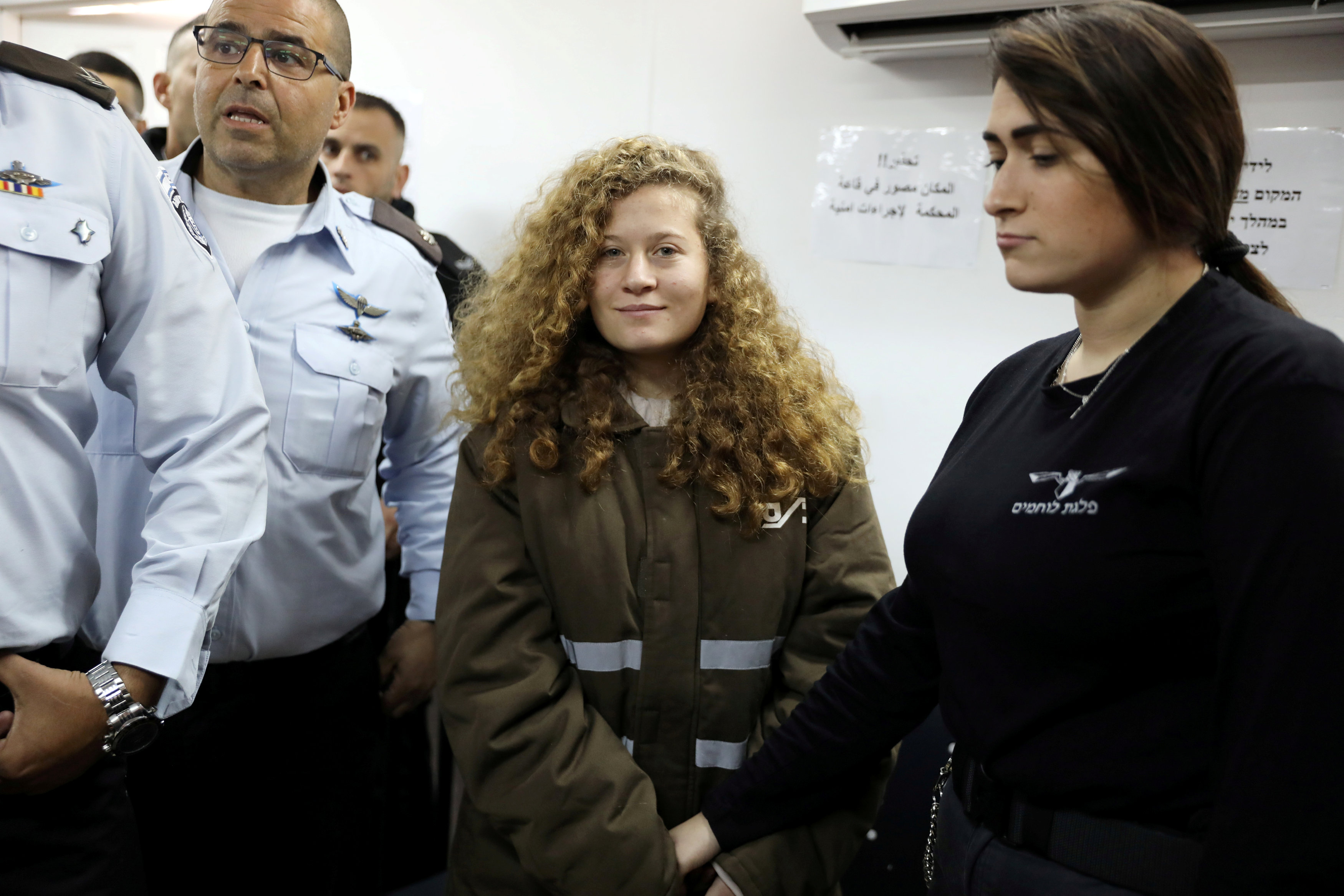 Palestinian teen Ahed Tamimi enters a military courtroom at Ofer Prison, near the West Bank city of Ramallah, January 15, 2018.