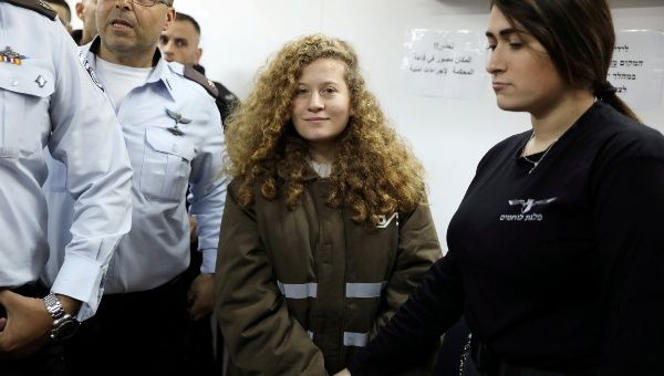 Palestinian teen Ahed Tamimi enters a military courtroom at Ofer Prison, near the West Bank city of Ramallah, January 15, 2018. 