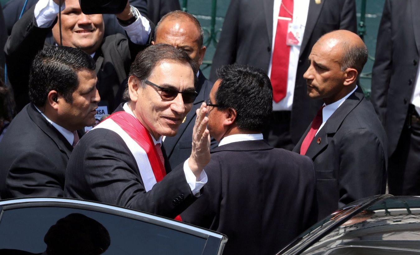 Peru's new President Martin Vizcarra waves to supporters after being sworn in at Congress in Lima, March 23, 2018.
