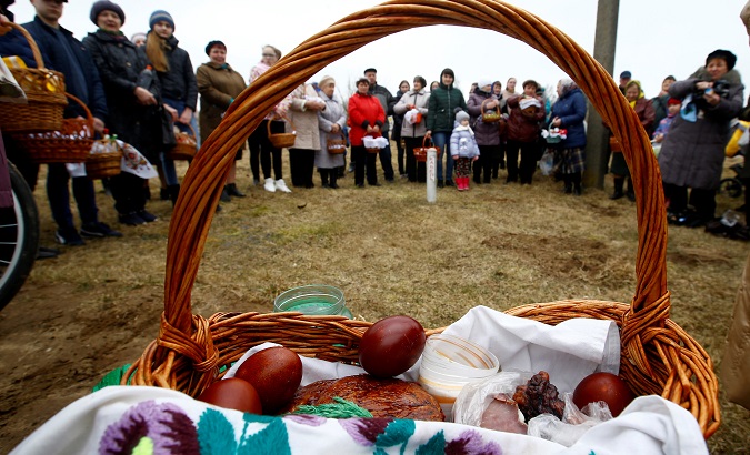 People gather for a service on the eve of Easter Sunday in the village of Krutilovichi, Belarus, March 31.