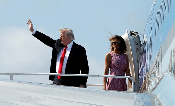 U.S. President Donald Trump and first lady Melania Trump board Air Force One at Palm Beach International Airport, Florida, U.S., en route to Washington after the Easter weekend at his Mar-a-Lago estate in Palm Beach, April 1, 2018