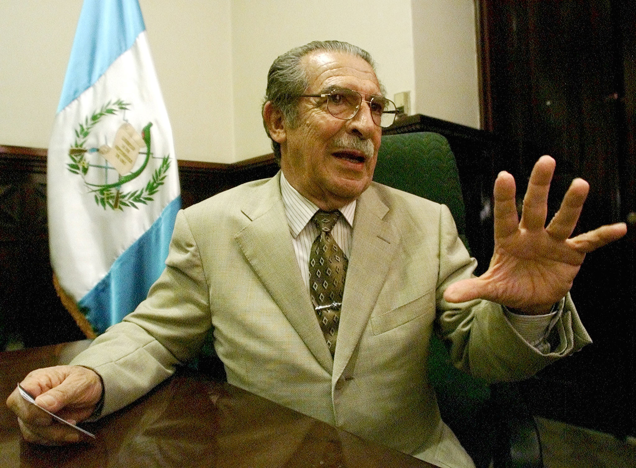 Guatemalan retired Gen. Efrain Rios Montt answers questions during an interview with Reuters at his Guatemala City office, July 2, 2002.