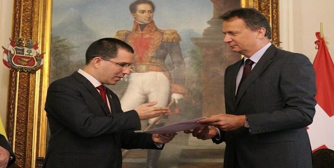 Venezuelan Foreign Minister Jorge Arreaza hands letter to the head of negotiations of the Swiss Confederation, Didier Chassot, demanding the Swiss government ends the economic sanctions placed on Venezuela last week be lifted