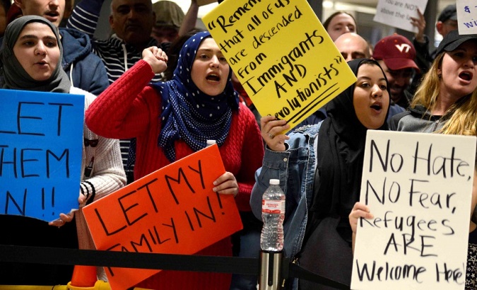 Muslim women protest against President Trump policies and rhetoric against Muslims and immigrants in the United States.