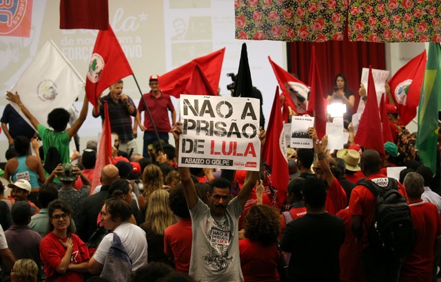 A Lula supporter's sign reads 