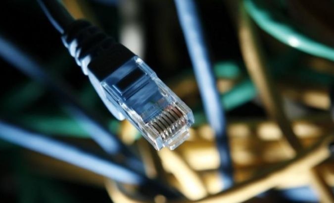 An internet cable is seen at a server room.