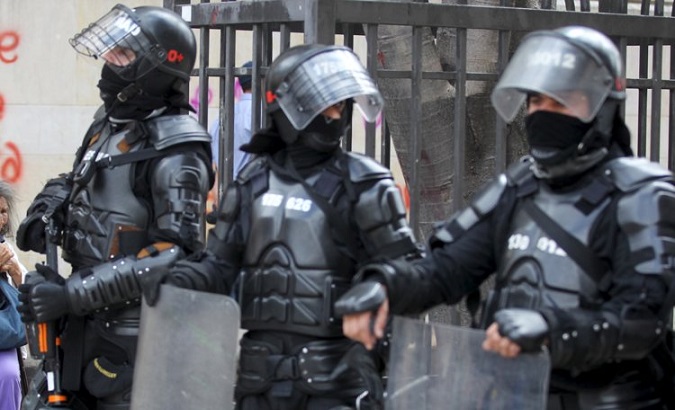 Riot police secures parameter during a nationwide strike against the government's education, labor and health policies in Bogota, Colombia March 17, 2016.
