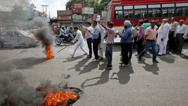 Anti-Muslim demonstrators shut down much of the town of Kathua in northern India on Wednesday. One woman said that if Hindu men accused of raping and killing a Muslim child are not released, “We will burn ourselves.’’ 