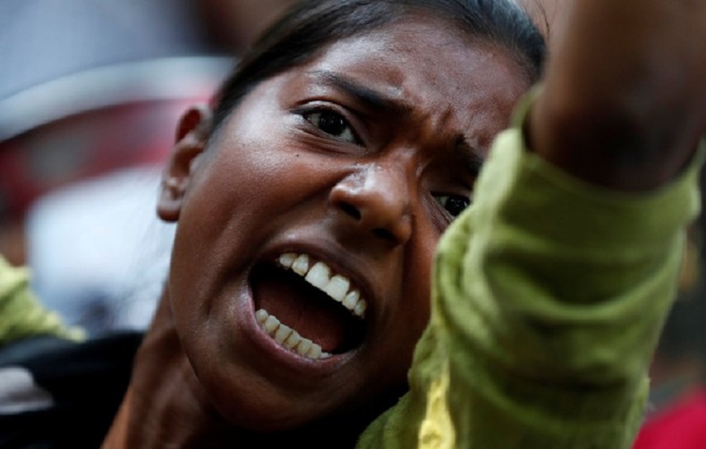 A woman reacts at a protest against the rape of an eight-year-old girl in Kathua near Jammu and a teenager in Unnao, Uttar Pradesh state, in New Delhi, India April 12, 2018.