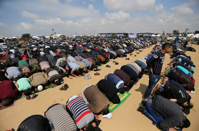 Palestinians pray on a Friday, before protests begin. 