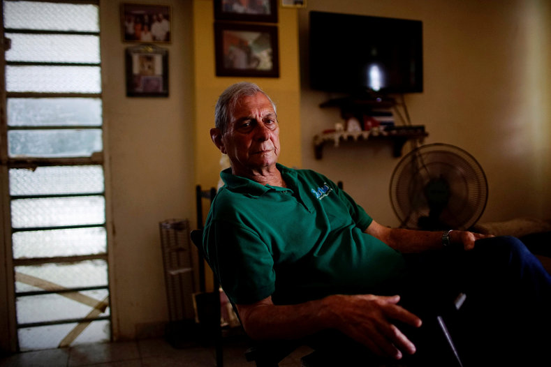 Former rebel Andres Peraza, 75, poses for a photo in Havana.