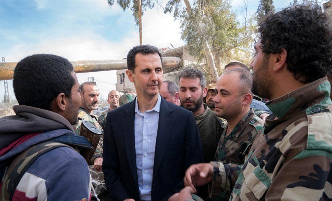 Syrian President Bashar al-Assad meets with Syrian army soldiers in eastern Ghouta, Syria, March 18, 2018.