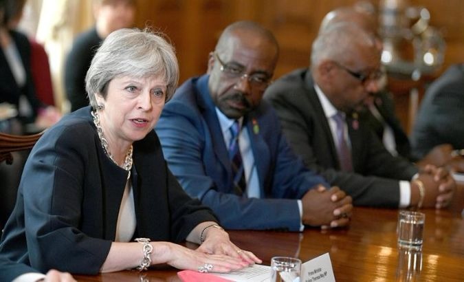British Prime Minister Theresa May talks to Commonwealth leaders in London.