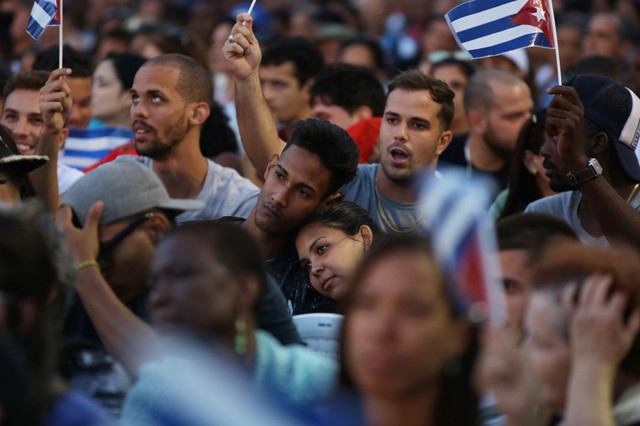 Students react during a ceremony to mark the 57th anniversary of the declaration of the socialist character of the Cuban Revolution in Havana, Cuba, April 16, 2018.