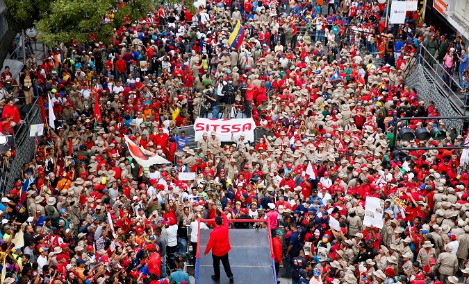 Venezuela's President Nicolas Maduro greets supporters during a rally in Caracas, Venezuela April 14, 2018.