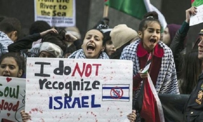 A demonstrator chants slogans during a pro-Palestinian protest in Times Square, in Manhattan.