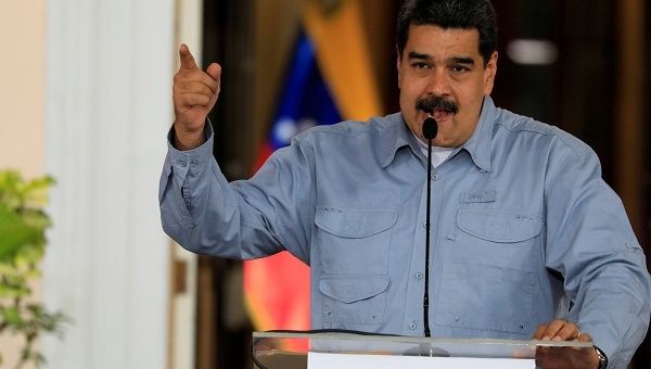 A session of Venezuela's legislature, temporarily disqualified for disregarding the Supreme Court, has approved discussion of Maduro's theoretical removal from office.