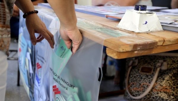 A woman casts her ballot during national election day in Asuncion, Paraguay April 22, 2018. 