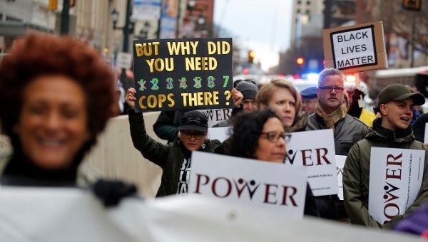 Protesters march down Market Street in Philadelphia, a week after two Black men were arrested at a Starbucks coffee shop, in Philadelphia, Pennsylvania.