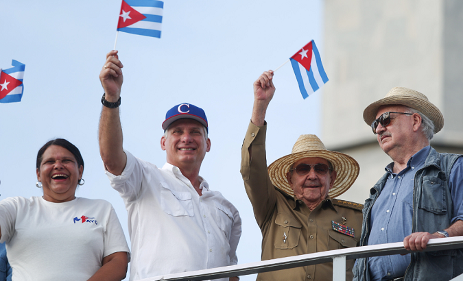 Cuba's Secretary of the Communist Party in Havana Lazara Mercedes Lopez (L), Cuba's President Miguel Diaz-Canel (2-L), the first Secretary of the Communist Party and former President Raul Castro (2-R),and pre12-yearof the Communist Party of Chile Guillermo Teillier watch the May Day rally in Havana, Cuba. Photo: Reuters