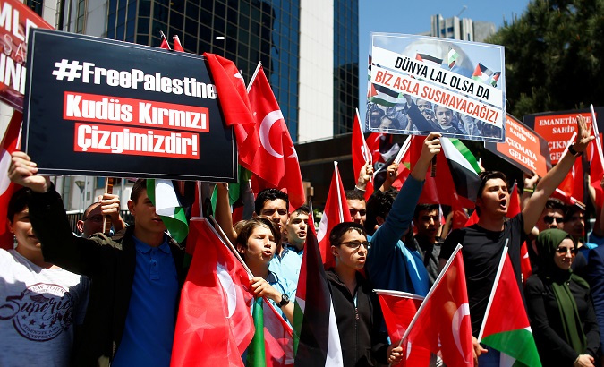 Pro-Palestinian demonstrators shout slogans during a protest against the U.S. embassy move to Jerusalem, near the Israeli consulate in Istanbul.