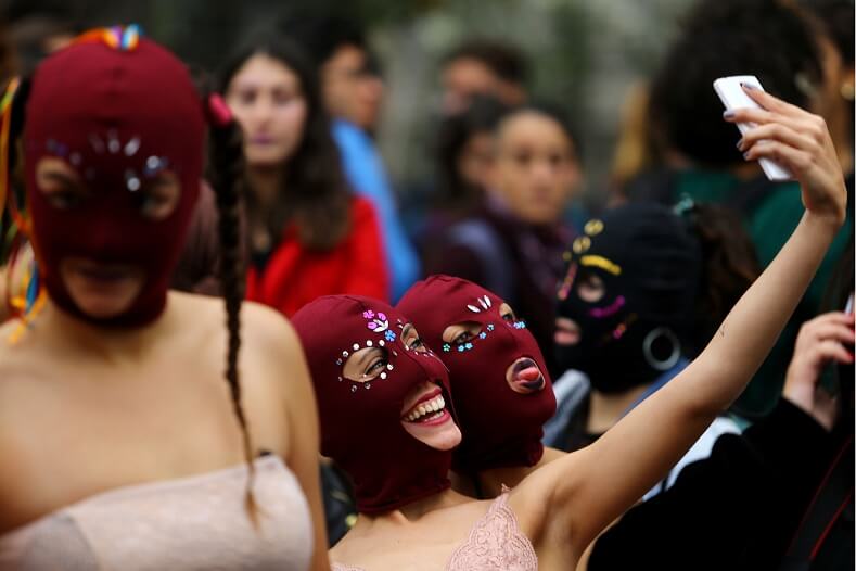 Some protesters wore decorated balaclavas. 